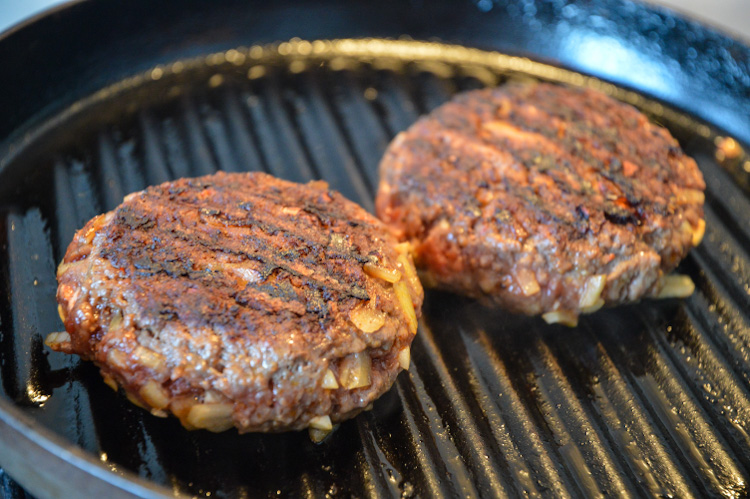 Two hamburgers on a grill pan