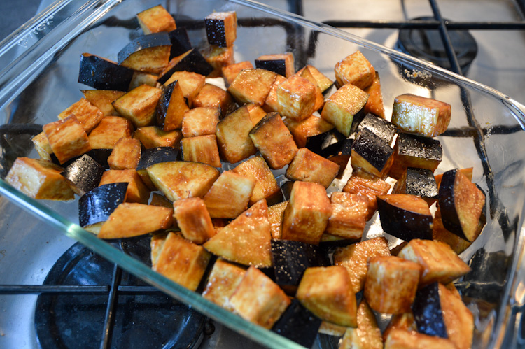 Raw eggplant marinated in miso sauce in a glass baking dish