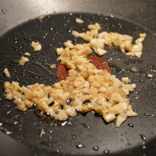 Ginger and garlic sauteeing in a pan