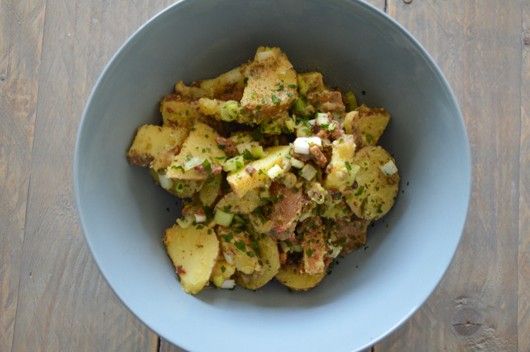 Bowl with German Potato Salad with Capers and Caraway