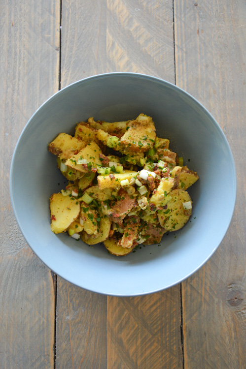 Bowl with tasty German Potato Salad on a table