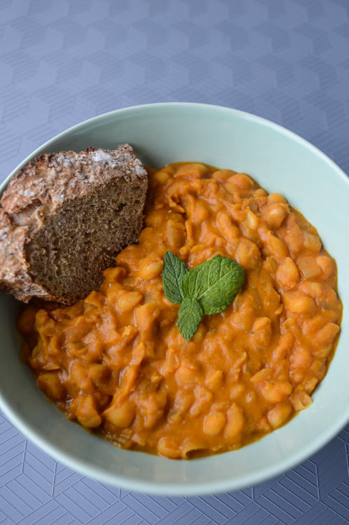 Bowl of Macedonian beans - our version of tavce gravce - with a piece of toast