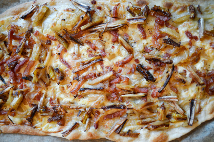 Close up of Flammkuchen with white asparagus