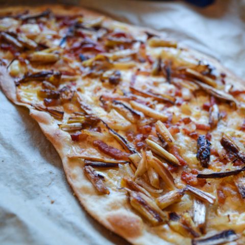 Close up of Flammkuchen with white asparagus