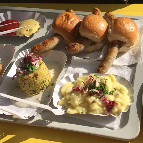 Plates of Brauhaus food in Berlin including German Potato Salad