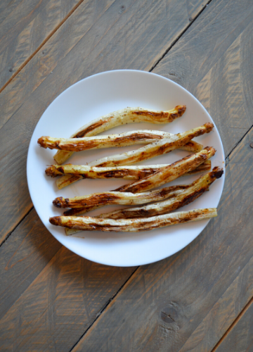 Roasted white asparagus on a white plate