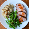 Thai Grilled Pork: sliced pork tenderloin plated with green beans and quinoa