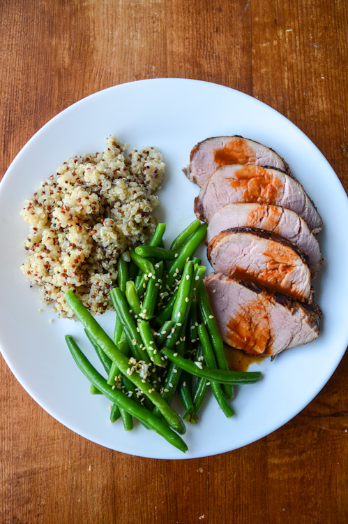 Thai Grilled Pork: sliced pork tenderloin with a sauce made from red curry paste, plated with green beans and quinoa