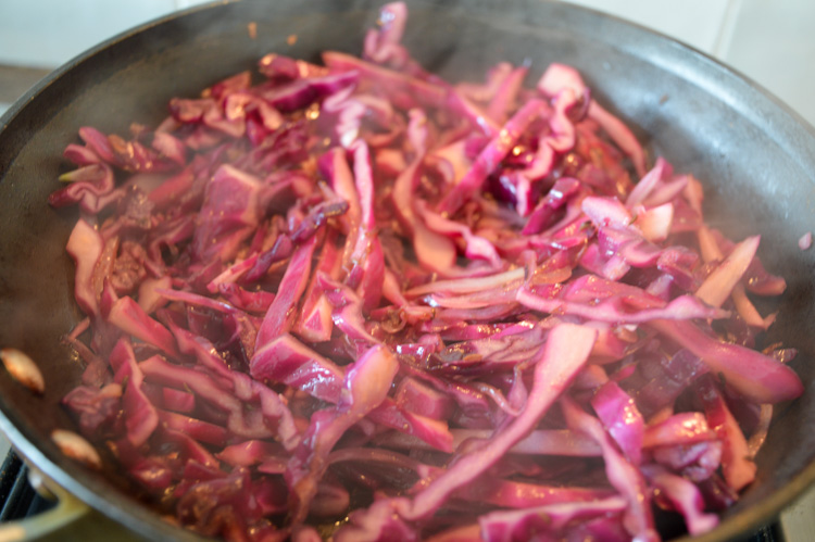 Red cabbage cooking in a pan