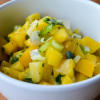 Close up of a white bowl with spicy mango salsa