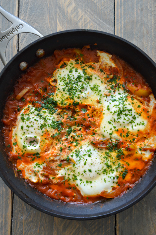 Shahkshuka for two in a skillet with four eggs and parsley