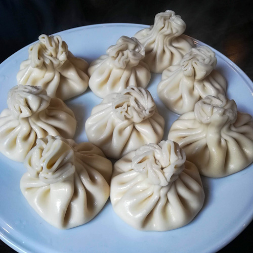 An absolutely mouthwatering looking plate of 9 khinkali (Georgian dumplings)