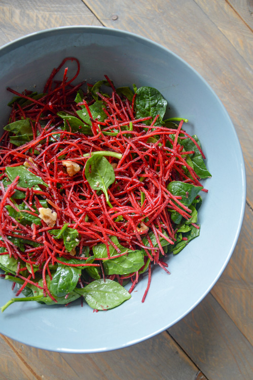 A bowl full of beet salad with maple lime dressing (and spinach and walnuts!)