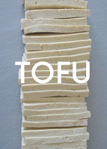 Background image: white slices of tofu; text overlay: tofu