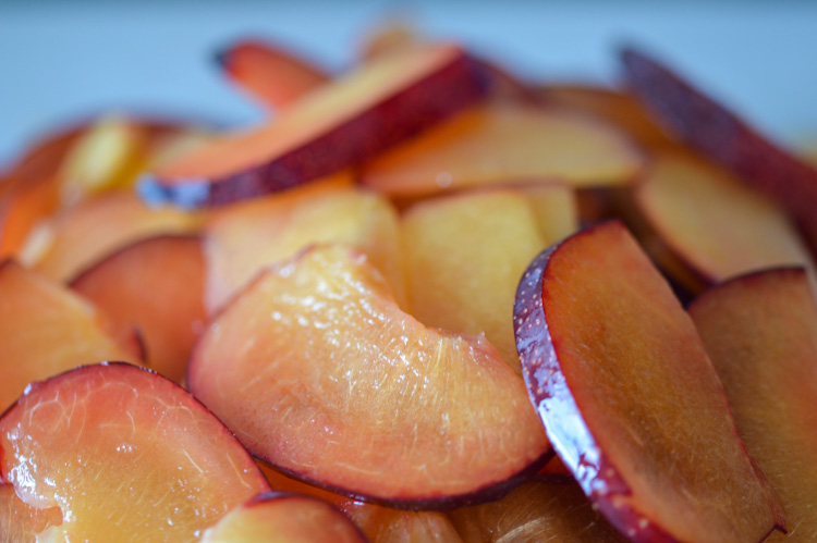 Thinly sliced fresh plums in a pile